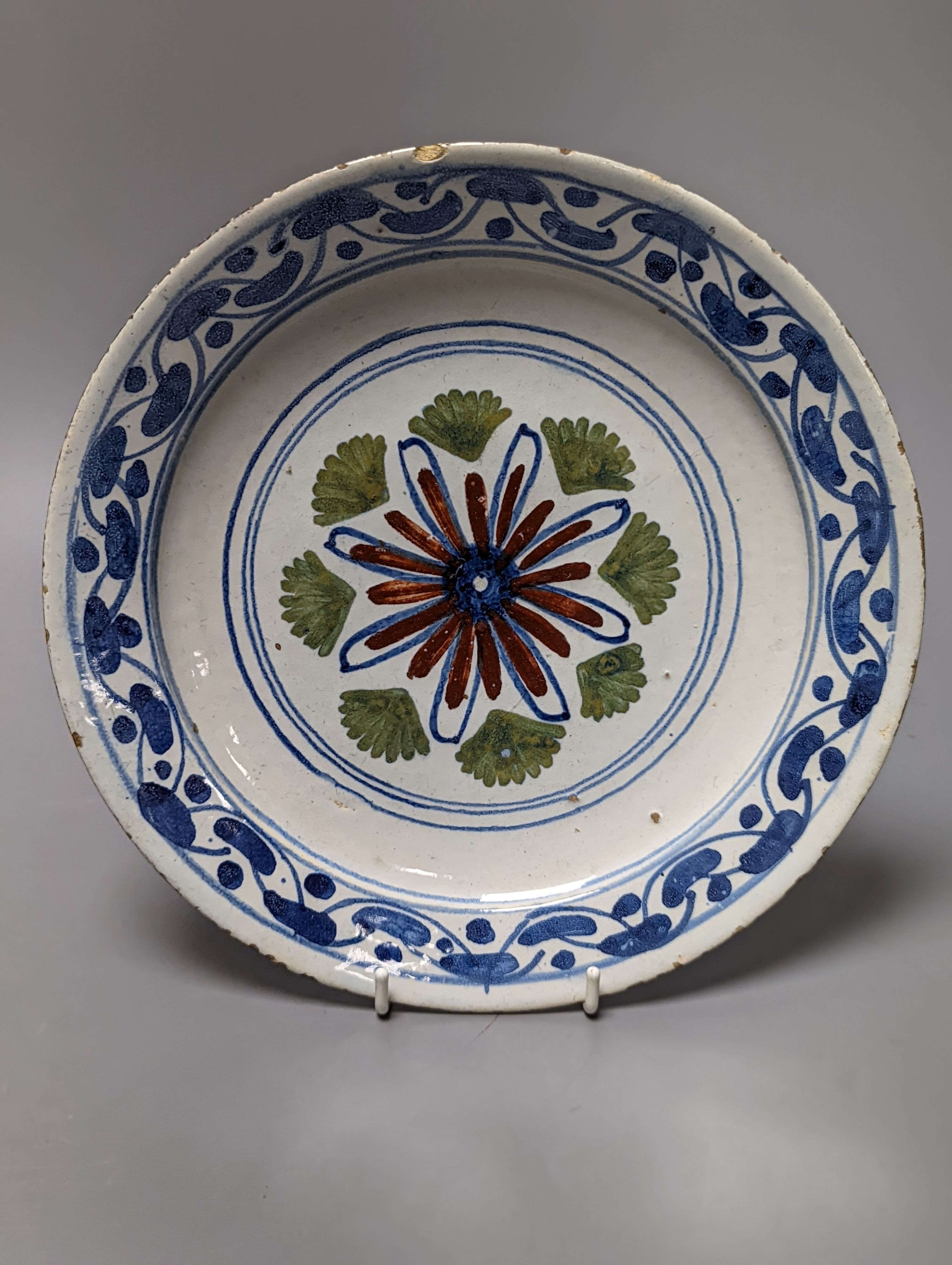 Seven English and Dutch delftware plates and dishes, c.1700-1760, 22 - 23cm, some damage